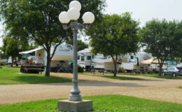 Lamppost in RV campground with picnic tables