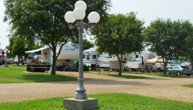 Lamppost in RV campground with picnic tables