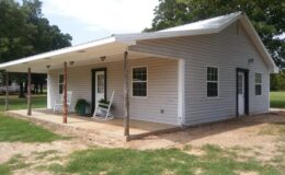 White country house with porch and rocking chairs